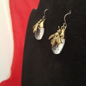 Clear stone with brass bee design